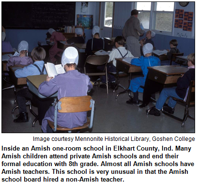 Inside an Amish one-room school in Elkhart County, Ind. Most Amish children attend private Amish schools and end their formal education with 8th grade. Almost all Amish schools have Amish teachers. This is school is very unusual in that the Amish school board hired a non-Amish teacher. Image courtesy Mennonite Historical Library, Goshen College.