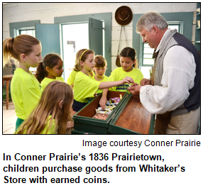 In Conner Prairie’s 1836 Prairietown, children purchase goods from Whitaker’s Store with earned coins.