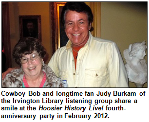 Cowboy Bob and longtime fan Judy Burkam of the Irvington Library listening group share a smile at the Hoosier History Live! fourth-anniversary party in February 2012. 