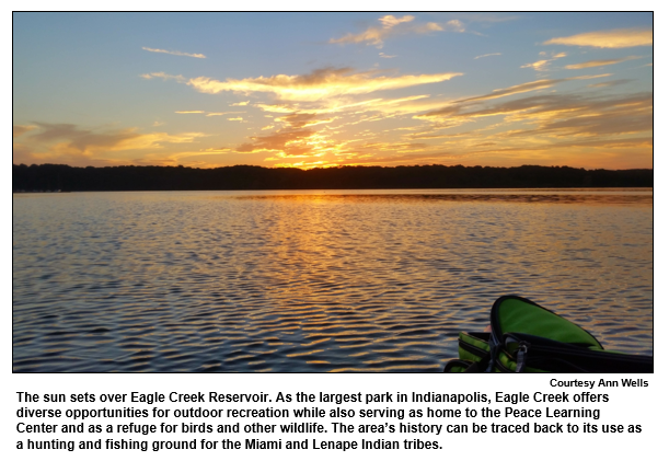 The sun sets over Eagle Creek Reservoir. As the largest park in Indianapolis, Eagle Creek offers diverse opportunities for outdoor recreation while also serving as home to the Peace Learning Center and as a refuge for birds and other wildlife. The area’s history can be traced back to its use as a hunting and fishing ground for the Miami and Lenape Indian tribes.  
Courtesy Ann Wells.