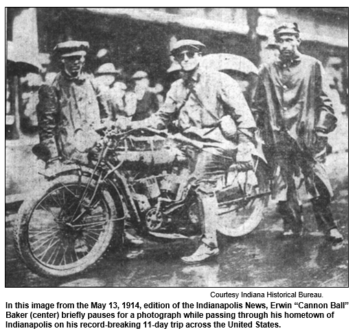 In this image from the May 13, 1914 edition of the Indianapolis News, Erwin Cannon Ball Baker (center) brieflly pauses for a photograph while passing through his hometown of Indianapolis on his record-breaking 11-day trip across the United States.  Courtesy Indiana Historical Bureau.