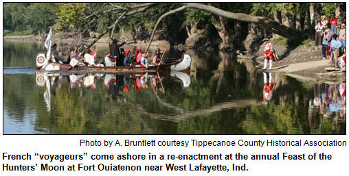 French “voyageurs” come ashore in a re-enactment at the annual Feast of the Hunters’ Moon at Fort Ouiatenon near West Lafayette, Ind. 