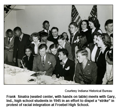 Frank  Sinatra (seated center, with hands on table) meets with Gary, Ind., high school students in 1945 in an effort to dispel a strike in protest of racial integration at Froebel High School.
Courtesy Indiana Historical Bureau.