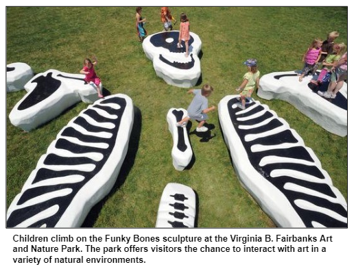 Children climb on the Funky Bones sculpture at the Virginia B. Fairbanks Art and Nature Park. The park offers visitors the chance to interact with art in a variety of natural environments.