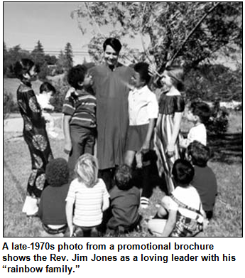 A late-1970s photo from a promotional brochure shows the Rev. Jim Jones as a loving leader with his “rainbow family.”