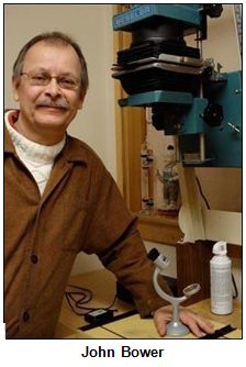 John Bower, photographer, with photographic equipment.