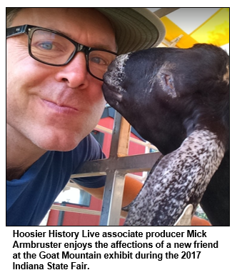 Hoosier History Live associate producer Mick Armbruster enjoys the affections of a new friend at the Goat Mountain exhibit during the 2017 Indiana State Fair. 
