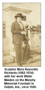 Sculptor Myra Reynolds Richards (1882-1934) with her work Water Maiden on the Murphy Memorial Fountain in Delphi, Ind., circa 1920. 
