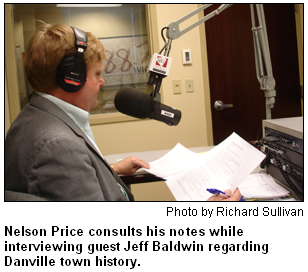 Nelson Price consults his notes while interviewing guest Jeff Baldwin regarding Danville town history. Photo by Richard Sullivan.