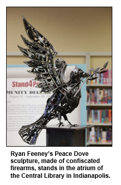 Ryan Feeney’s Peace Dove sculpture, made of confiscated firearms, stands in the atrium of the Central Library in Indianapolis.
