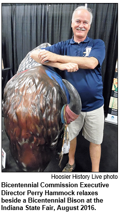 Bicentennial Commission Executive Director Perry Hammock relaxes beside a Bicentennial Bison at the Indiana State Fair, August 2016.
Hoosier History Live photo.