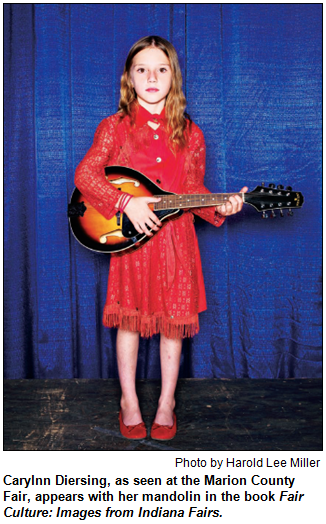 Carylnn Diersing, as seen at the Marion County Fair, appears with her mandolin in the book Fair Culture: Images from Indiana Fairs. Photo by Harold Lee Miller.