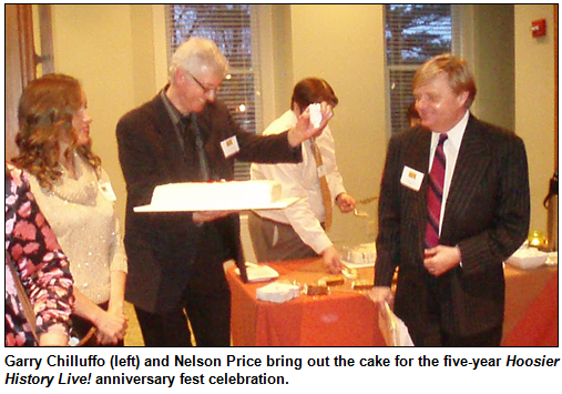 Garry Chilluffo (left) and Nelson Price bring out the cake for the five-year Hoosier History Live! anniversary fest celebration. Photo by Bill Holmes.