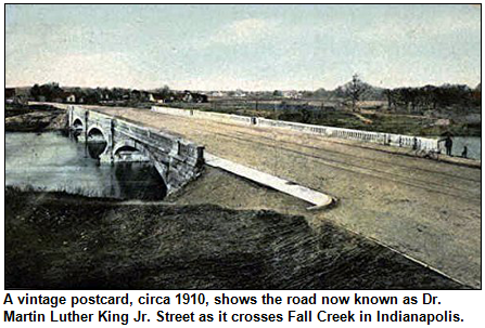 A vintage postcard, circa 1910, shows the road now known as Dr. Martin Luther King Jr. Street as it crosses Fall Creek in Indianapolis.